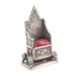 A silver pin cushion in the form of the Coronation throne, Birmingham 1901 by Levi and Salaman,