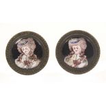 A pair of late 18th Century English enamel mounted brass handles or curtain tie backs, each with a