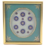 Buttons - a framed display of two sets of early 19th Century enamel buttons, probably French,