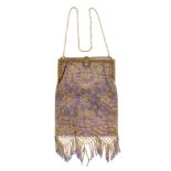 An early 20th Century beadwork bag, of rectangular form decorated with purple trailing flowers on