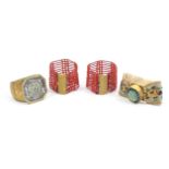 Four 19th Century bangles and bracelets, comprising a pair of cord and coral bead with fancy gilt