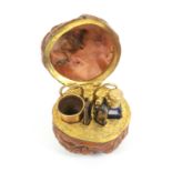 A miniature sewing set for a child or a doll contained in a natural walnut, gilt brass hinge