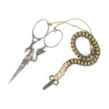 A pair of mid 19th Century French steel scissors, diamond section tapering blades one arm shaped and
