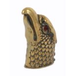 A brass novelty vesta case, in the form of an eagles head with glass eyes, 6.5cm.Ê