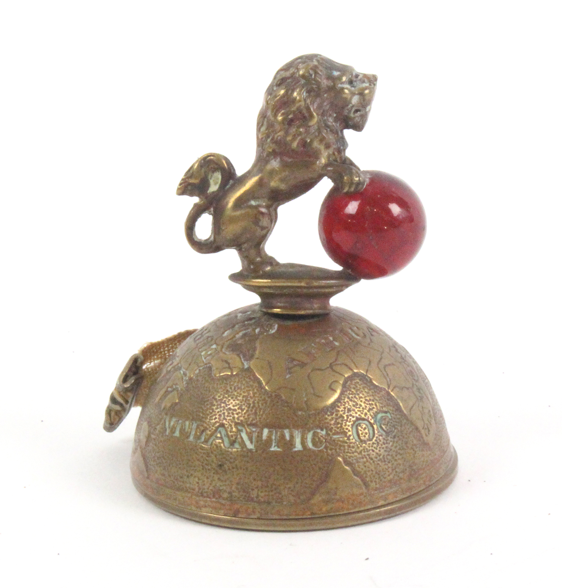 A novelty brass tape measure in the form of a half globe surmounted by a lion holding a glass - Image 2 of 2