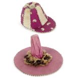 Two hat form pin cushions, comprising a jockey cap in alternate purple and cream segments edged with