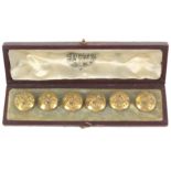 Buttons - a cased set of six floral gilt buttons by Firmin, each 1.5cm dia., set in pale blue