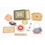 Lady's exercise pieces, comprising a miniature beadwork decorated bonnet, 3cm, a beadwork bag, 10cm,