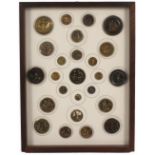 Buttons - a framed display of twenty five, all figural, mostly in relief including one of a tennis