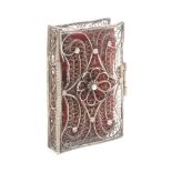 An 18th Century English silver filigree 'almanack' needle book, each cover with central