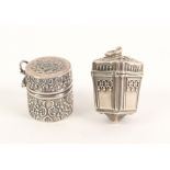 A silver vinaigrette and a thimble box, the first of square section and tapering form with decorated