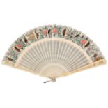 An attractive early 19th Century ivory fan, probably Chinese, the pierced ivory guards enclosing