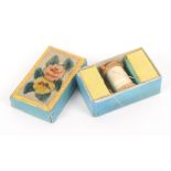 A small early 19th Century cardboard sewing box, covered in blue paper the lid with a floral painted