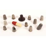 A collection of thimbles, comprising eleven silver thimbles, five hallmarked including a modern