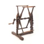 An attractive late 18th Century fruit wood winder, for wrapping yarn, the 'T' shaped base with one