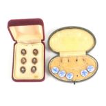Buttons - two cased sets comprising five only blue floral painted domed small buttons with brass
