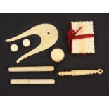 A mixed lot of 19th Century ivory sewing tools, comprising a lyre form lucet, 8.5cm, a reeded