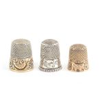Three American thimbles comprising a silver gilt example by Stern Brothers and Company, engraved