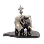 A 19th Century silver mounted capronised ebony elephant, Sri Lanka, the standing elephant with