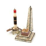 A rare cardboard sewing companion by Reynolds and Co. in the form of Cleopatras needle, the