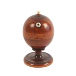 An attractive turned and stained boxwood wool ball or string box holder, turned pedestal on circular