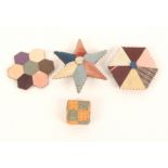 Four patchwork and pin stuck pin cushions and cards, comprising one formed from seven octagons, 5.