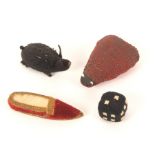 Four figural material pin cushions, comprising a red cloth pin stuck ladybird, 6.5cm, a black and