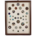 Buttons - a fine framed display of thirty five enamel decorated buttons, including three 18th