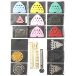 A collection of Australian knitting pin gauges, comprising seven casein/plastic 'Paton' beehives,