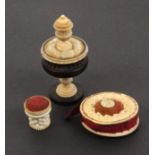 Three pin cushions, comprising a late 18th Century engine turned rosewood and ivory example of