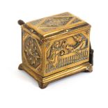 A rare brass novelty tape measure in the form of a barrel organ, the front depicting Punch and
