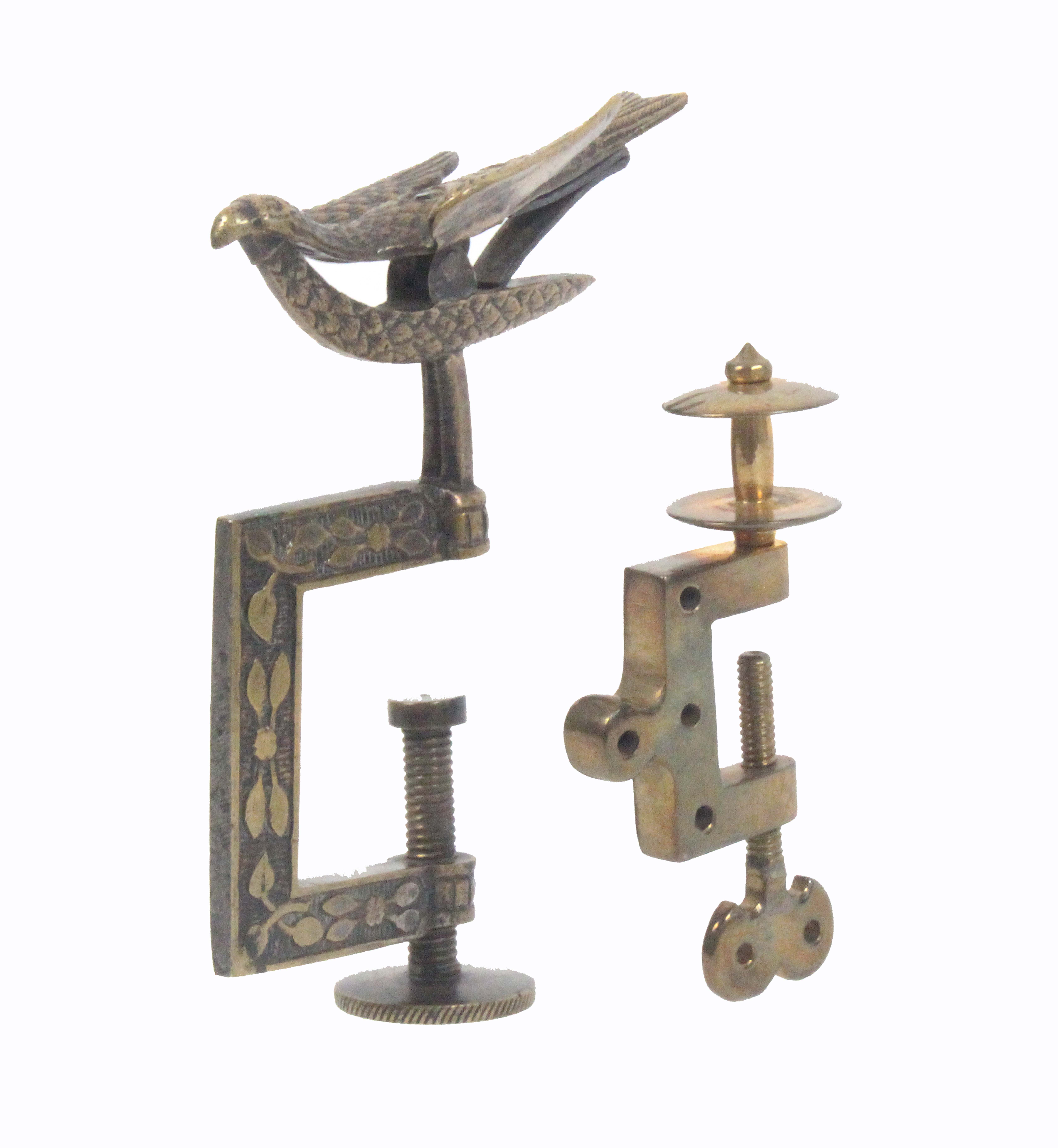 Two metal sewing clamps, comprising a miniature brass example perhaps for a child or doll, the