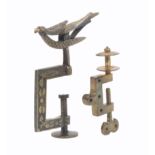 Two metal sewing clamps, comprising a miniature brass example perhaps for a child or doll, the