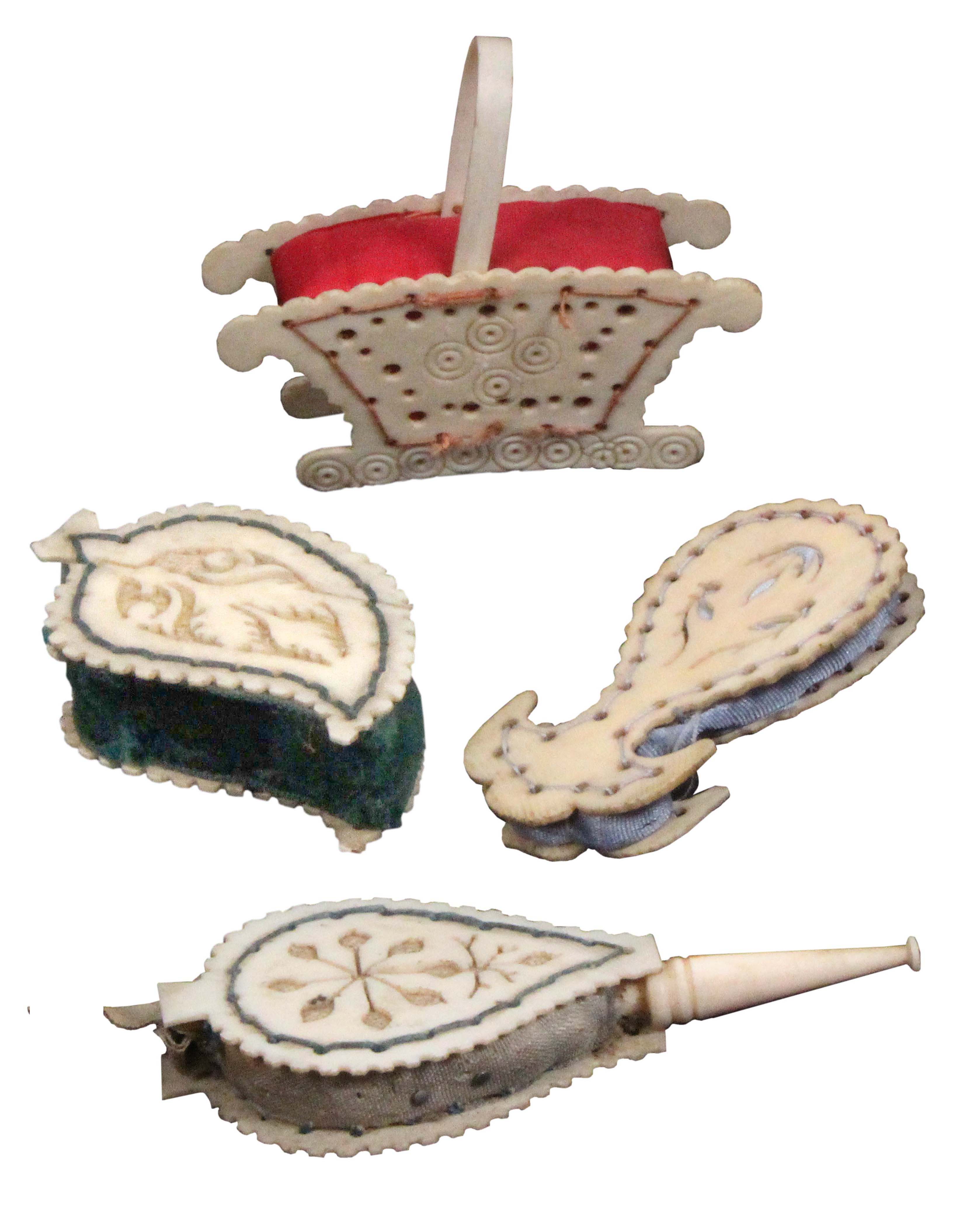 Four 19th Century bone or ivory pierced board pin cushions, comprising a basket with swing handle, a