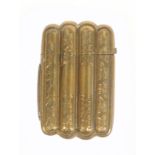 A Victorian gilt brass novelty vesta case, in the form of a cigar case engraved with leaf sprays,