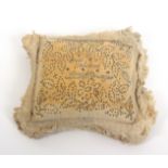 An early 19th Century layette pin cushion, of fringed rectangular form with a pin stuck design and