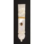 A good early 19th Century Palais Royal mother of pearl needle case, carved and engraved as a
