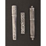 Three silver bodkin and needle cases, comprising an oval section tapering example with engraved