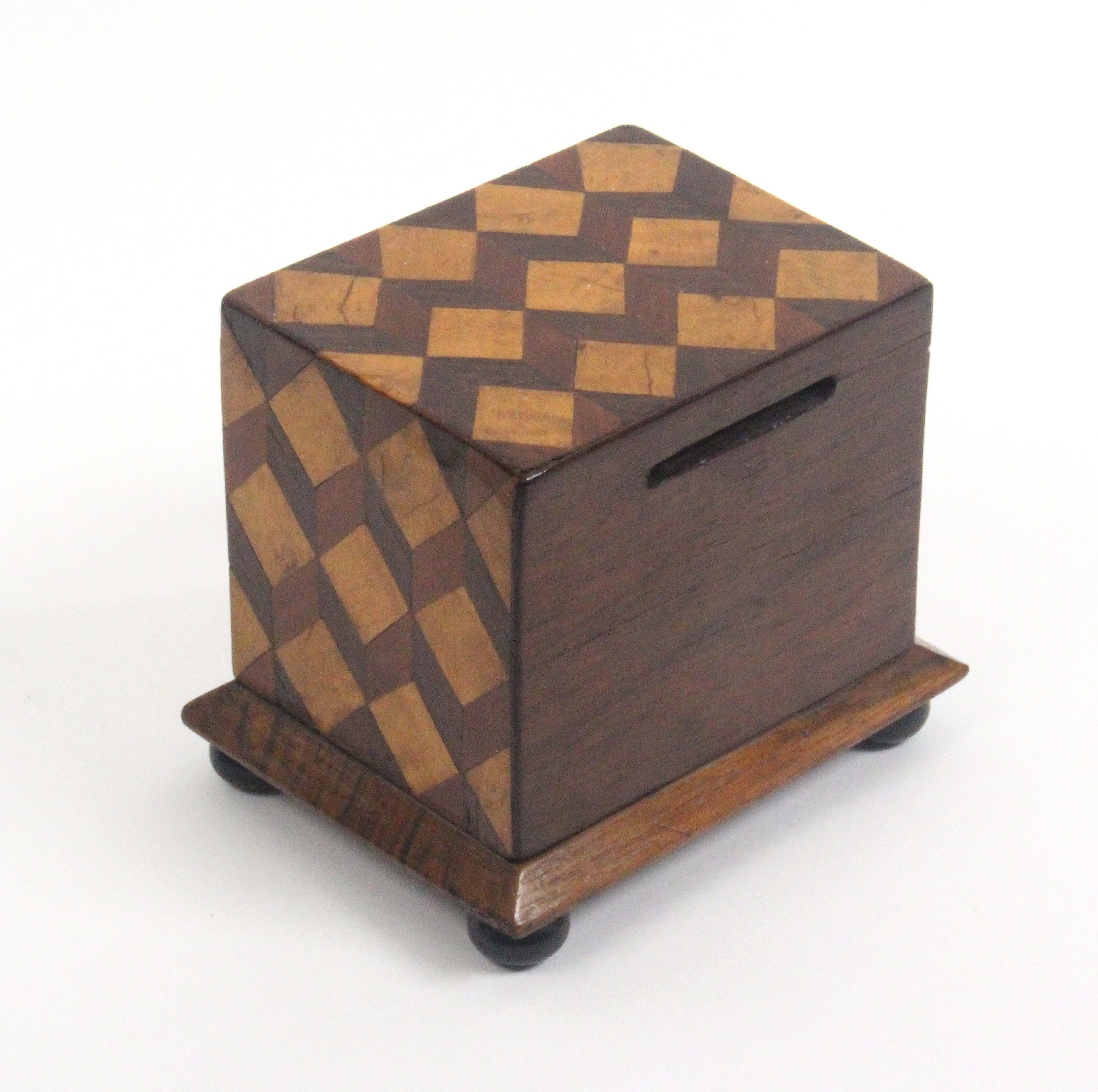 A documentary money box, decorated in cube pattern of rectangular form on a chamfered plinth base - Image 2 of 3