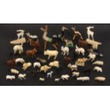 A mixed lot of 19th Century and early 20th Century carved ivory animal figures, including a pair