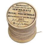 A rare early Victorian bone reel for the use of The Royal Household, one end with gilt and red Royal