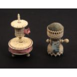 Two bone combination pin cushion/tape measures, comprising an example with disc form pin cushion