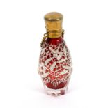 A late 19th Century ruby glass tinted scent bottle, of octagonal section the body overlaid with