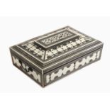 An early 19th Century Anglo Indian ivory veneered and Sadeli work sewing box of sarcophagol form,