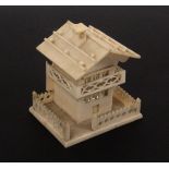 A 19th Century bone thimble  case in the form of a Swiss chalet, the chimney with Stanhope (