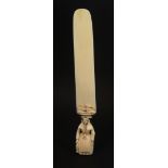 A 19th Century Dieppe carved ivory paper knife or page turner, the handle carved with a