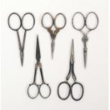Five pairs of 19th Century scissors, comprising a steel pair with gold dots, 9cms, another pair with