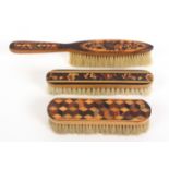 Three Tunbridge ware brushes, comprising an example in cube work, 16cm, another in mosaic, 17cm, and