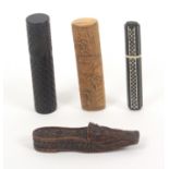 Four 19th Century needle cases, comprising an oval section ebony example with bone chequer board