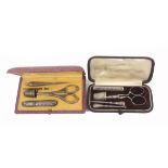 Two early 20th Century continental cased sewing sets, comprising a leather example with three silver